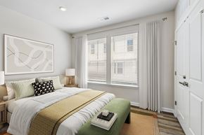 Sterling apartment for rent - A bedroom with a large bed and a painting on the wall.