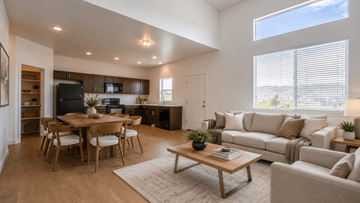 Bluffdale townhouse for rent - A modern living room with a dining table and a couch.
