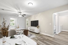Pooler apartment for rent - A modern dining room with a white table and chairs.