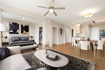 Tacoma apartment for rent - A modern living room with a white sofa and a black and white rug.