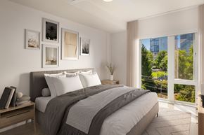 Seattle apartment for rent - a bedroom with a bed and a large window