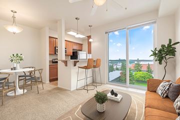 Tacoma apartment for rent - A living room with a brown couch and a brown coffee table.