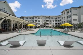 N Charleston apartment for rent - A pool with a fountain in the middle of it.
