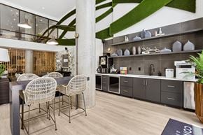Decatur apartment for rent - A modern dining area with a glass table and chairs.