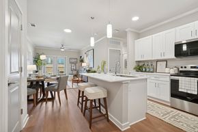 Columbia apartment for rent - A modern kitchen with a dining table and chairs.