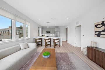 Princeton apartment for rent - A living room with a couch, a coffee table, and a painting on the wall.
