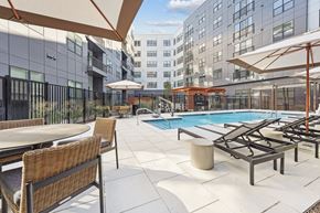 Baltimore apartment for rent - the pool area of a hotel with chairs and umbrellas