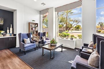 Mesa apartment for rent - A living room with a dark blue sofa and a wooden coffee table.