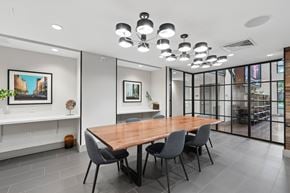 Washington apartment for rent - A conference room with a long table and chairs.