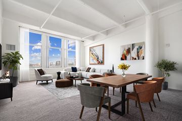 Philadelphia apartment for rent - A living room with a large table and chairs.