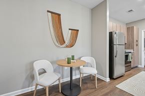 Fort Mill apartment for rent - A modern dining room with a wooden table and chairs.