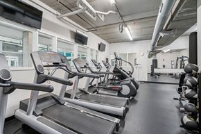Pittsburgh apartment for rent - A gym with treadmills and exercise equipment.