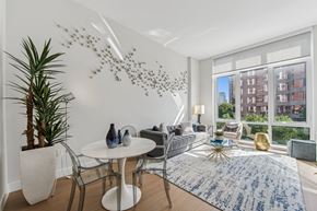 White Plains apartment for rent - A modern dining room with a white table and chairs.