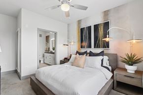 Decatur apartment for rent - A bedroom with a large bed and a ceiling fan.