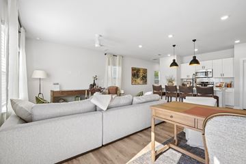 Concord apartment for rent - A modern living room with a grey sofa and a wooden coffee table.
