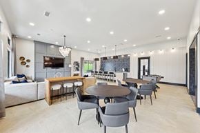 Chattanooga apartment for rent - A modern dining room with a wooden table and grey chairs.