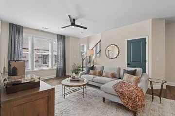 Sugar Hill apartment for rent - A living room with a grey couch and a wooden coffee table.