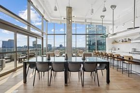 Chicago apartment for rent - A modern dining room with a glass table and chairs.
