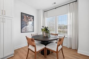 Charlotte townhouse for rent - A dining room with a round table and chairs.