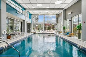 Pittsburgh apartment for rent - A large indoor swimming pool with a glass wall on one side.