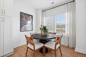 Charlotte townhouse for rent - A dining room with a round table and chairs.