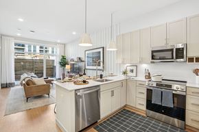 Lynn apartment for rent - A modern kitchen with a dining table and chairs.