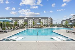 Fredericksburg apartment for rent - A large swimming pool in front of apartment buildings.