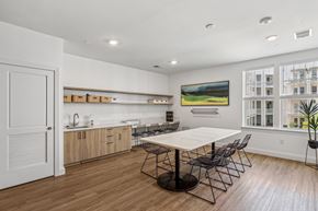 Williamsburg apartment for rent - a dining room with a table and chairs and a kitchen