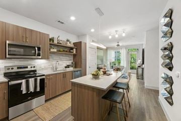 Herndon apartment for rent - a kitchen and living room with a table and chairs