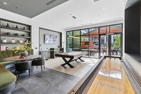 Hyattsville apartment for rent - A modern dining room with a long table and chairs.
