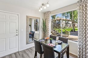 Mesa apartment for rent - Dining Area with a Glass Table at Vista Grove Apartments, Mesa, AZ, 85204