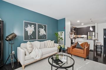 Quincy apartment for rent - A living room with a white couch and a coffee table.