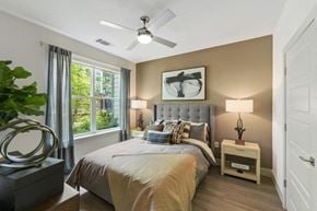 Herndon apartment for rent - a bedroom with a bed and a ceiling fan