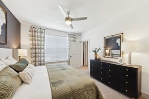 Chattanooga apartment for rent - A bedroom with a large bed and a dresser.