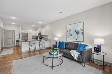 Hampton apartment for rent - A living room with a grey couch and a coffee table.