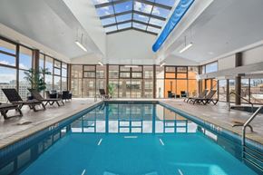 Philadelphia apartment for rent - a swimming pool with glass ceilings and a large windowed pool