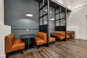 Charlotte apartment for rent - A modern dining area with a long table and chairs.