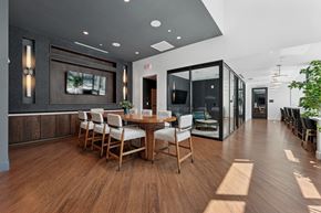 Falls Church townhouse for rent - A modern dining room with a wooden table and chairs.