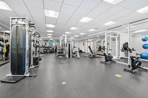 Capitol Heights apartment for rent - A spacious gym with various exercise equipment.