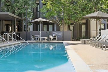 Brentwood apartment for rent - A pool with a diving board and a sign that says "Lazert".