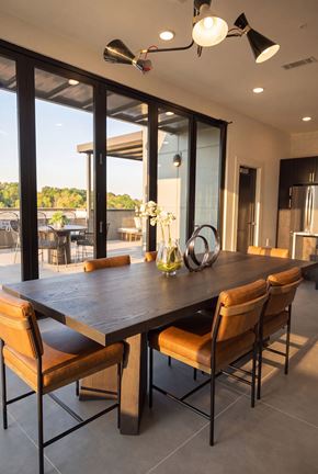 Charlotte apartment for rent - A modern dining room with a large table and chairs.