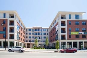 Beverly apartment for rent - Two cars are parked in front of a building.