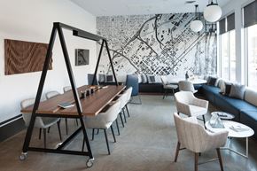 Denver apartment for rent - a room with a table and chairs and a large mural on the wall