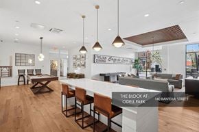 Beverly apartment for rent - A modern interior space with a bar area and seating.