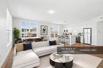 Beverly apartment for rent - A living room with a white couch and a coffee table.