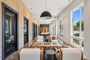 Marlborough apartment for rent - a dining room with a long table and chairs and a large window