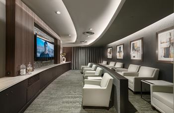 Intimate media rooms featuring surround-sound and theater-style seating