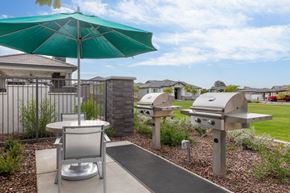 Peoria apartment for rent - the preserve at ballantyne commons community patio with bbq