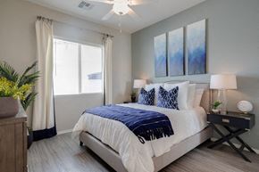 Peoria apartment for rent - a bedroom with a bed and a ceiling fan