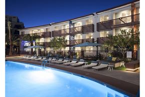 Scottsdale apartment for rent - A swimming pool in front of a hotel at night.
